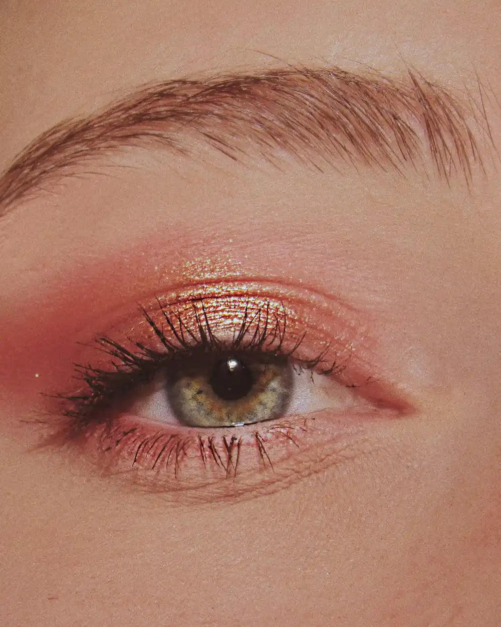 Close-up of an eye with rosy copper eyeshadow